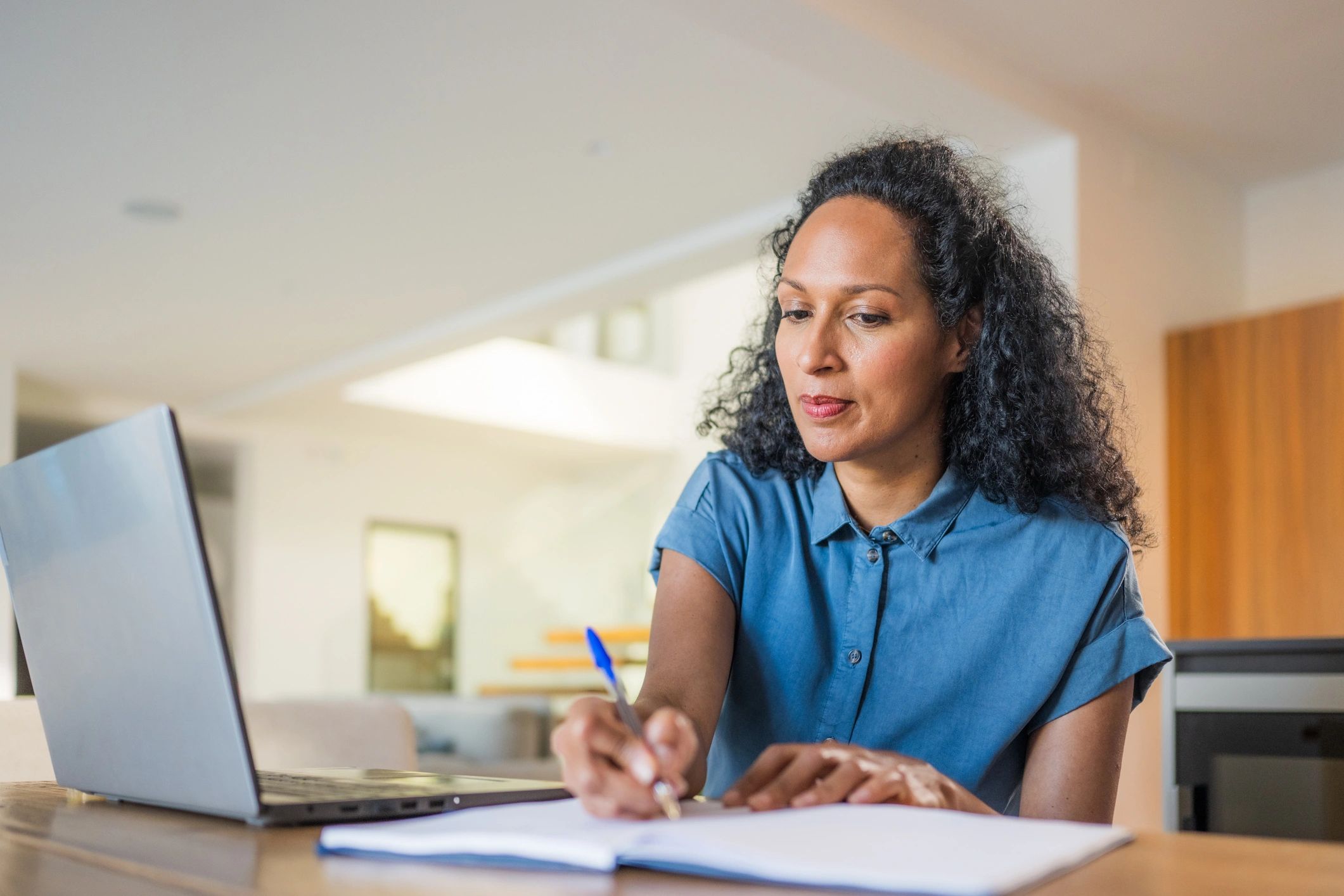 Professional taking notes during online training
